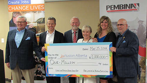 Inclusion Alberta receives a cheque from Pembina Pipeline Corporation